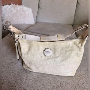Vintage cream Coach purse. Green interior needs cleaning. Silver hardware.